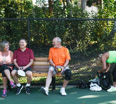 Residents enjoying a game outside in a sunny environment