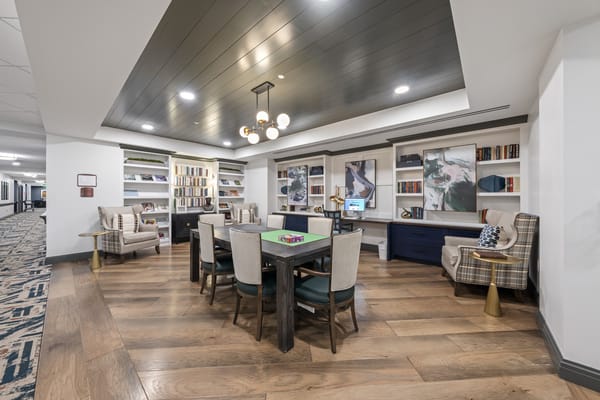 Common area with comfortable seating and bookshelves