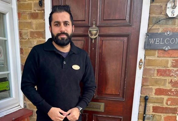 Staff member welcoming at the entrance door