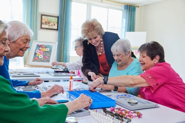 Residents engaging in a crafting activity at a table