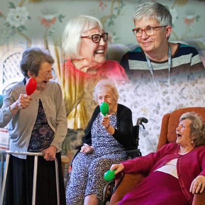 Residents enjoying a laughter-filled activity session