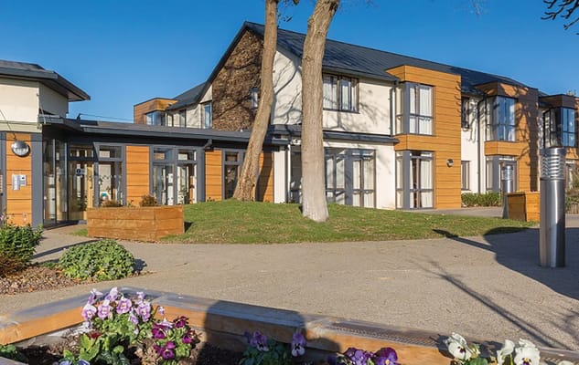Exterior view of Abbeyfield Bristol building with gardens