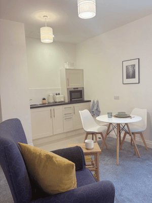Cozy interior of a resident's room with a dining area
