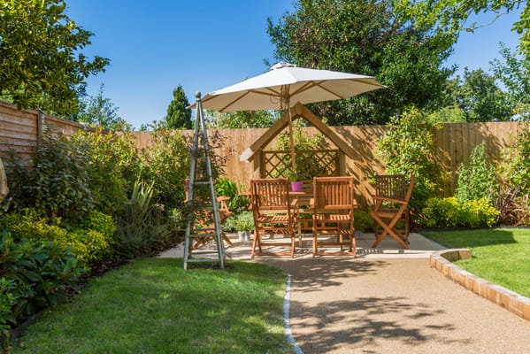 A peaceful outdoor garden area with seating