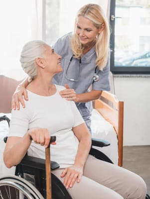 Nurse assisting a resident in a wheelchair