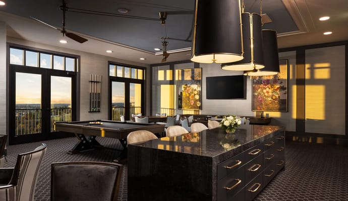 Luxurious common area with pool table and large windows