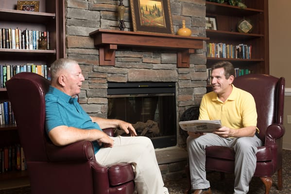 Residents enjoying conversation in a cozy common area