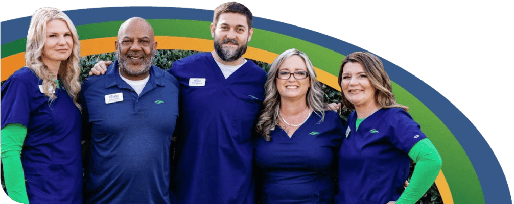 Staff members posing together outside