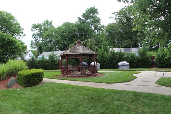 Outdoor gazebo in a landscaped area