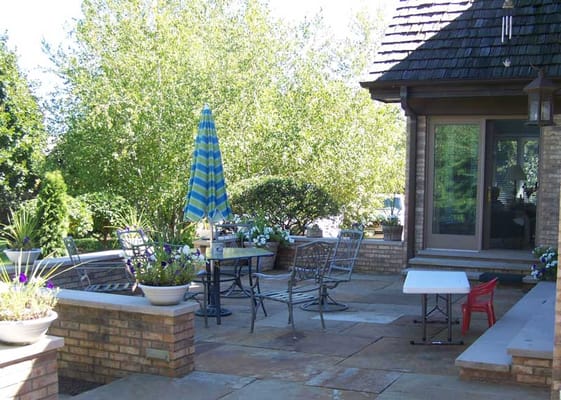 Patio area with seating and greenery