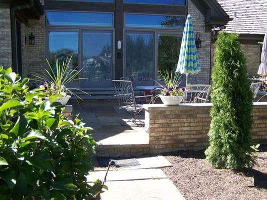 Outdoor patio space with chairs and plants