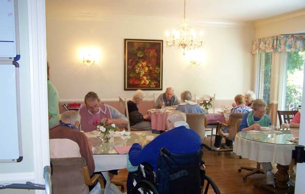 Residents enjoying a meal together in the dining room