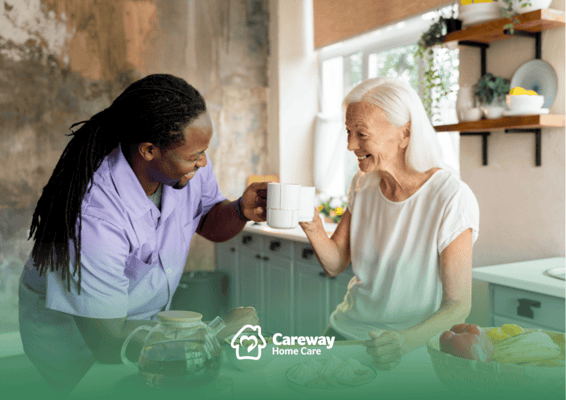 Caregiver and resident enjoying tea in the kitchen