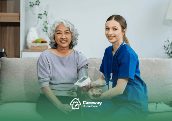 Nurse taking blood pressure of a resident in a cozy room