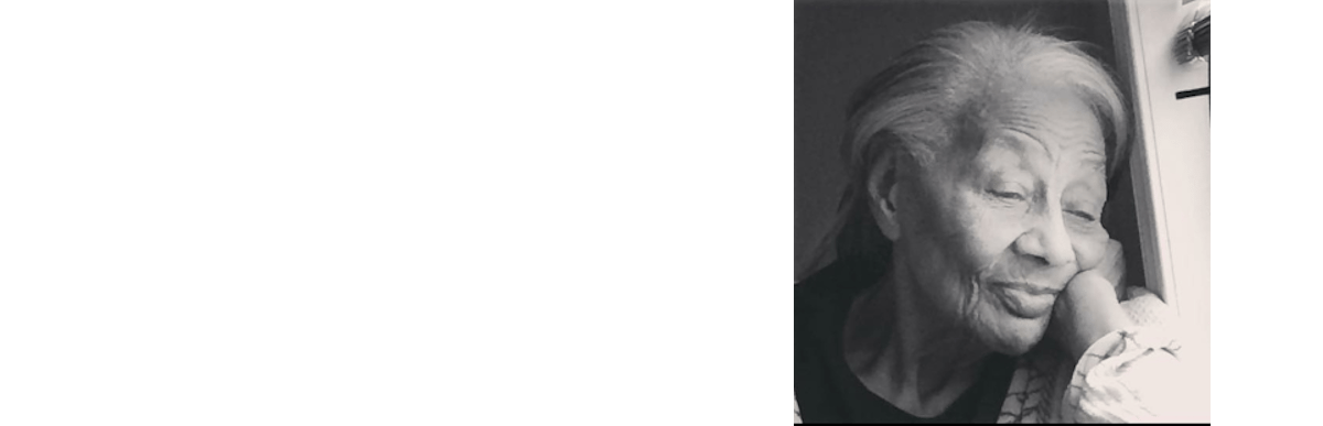 An elderly woman gazing thoughtfully by a window