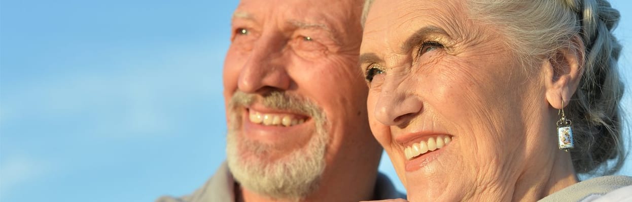 A happy elderly couple enjoying the outdoors