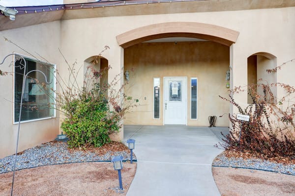 Front entrance of a senior living facility with landscaping