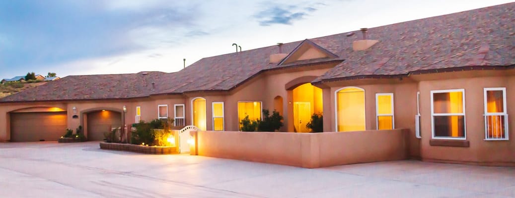Exterior view of a senior living facility at dusk