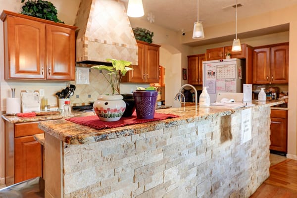 Well-equipped kitchen space with wooden cabinets