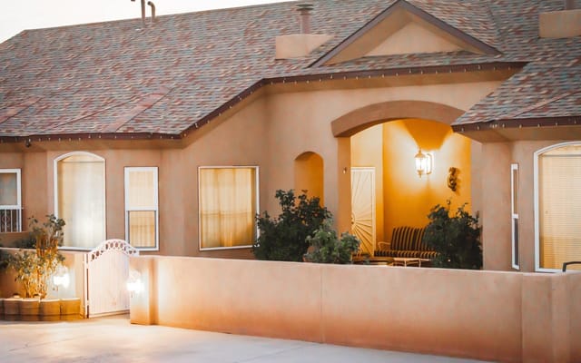 Exterior view of a senior living facility at dusk
