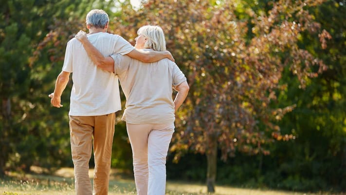 Couple walking together in a scenic outdoor space