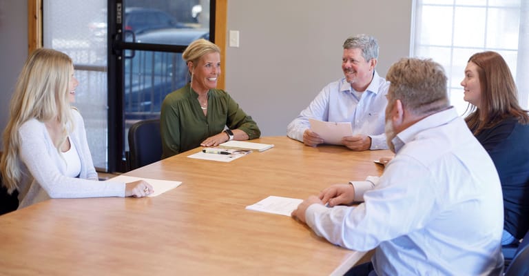 Group of staff members in a meeting room