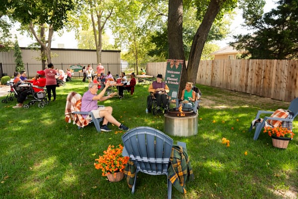 Residents enjoying an outdoor gathering with friends