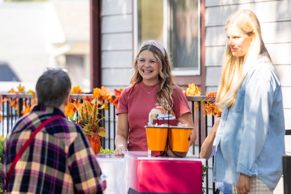 Staff and residents engaging during an outdoor event