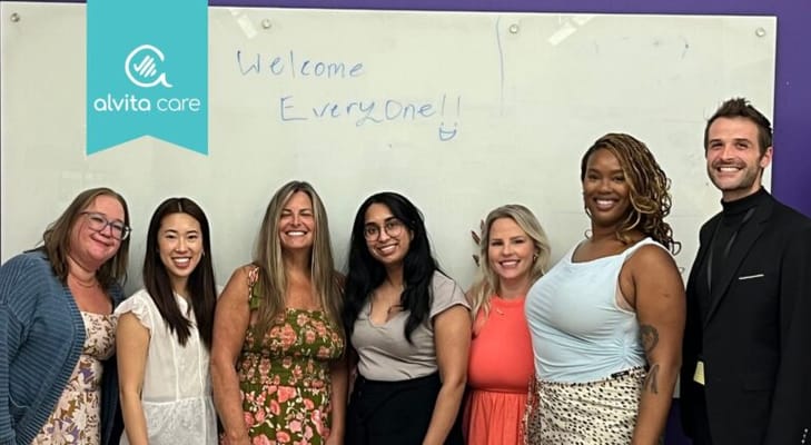 Alvita Care logo with staff members smiling