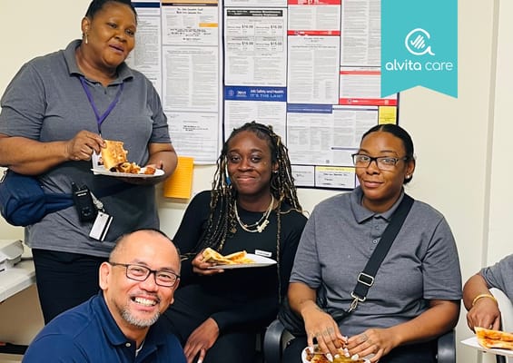 Staff and residents enjoying food together