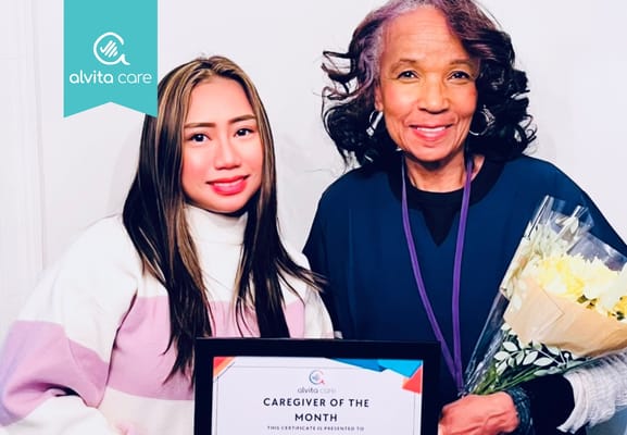 Employees celebrating Caregiver of the Month award