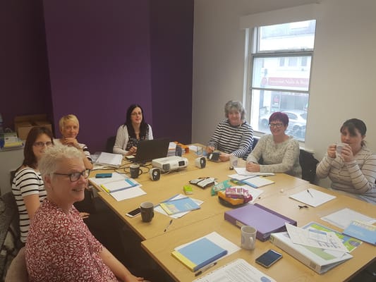 Staff meeting in a brightly lit room