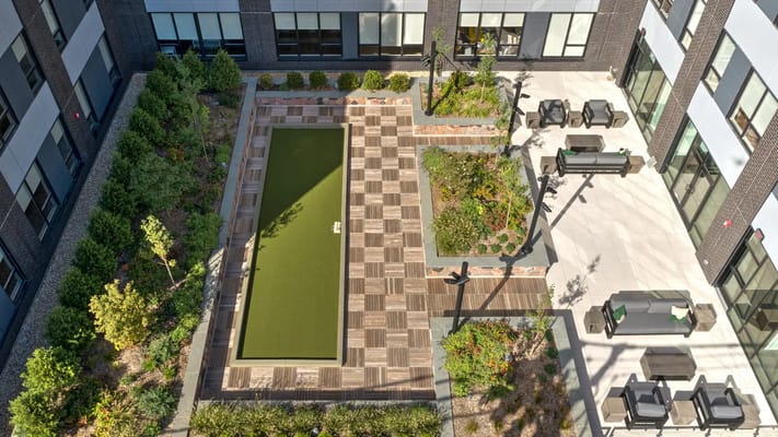Aerial view of a landscaped outdoor area with seating