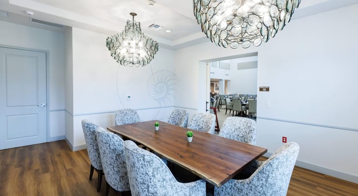 Elegant dining area with a large wooden table and stylish chairs