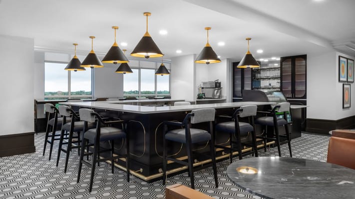 Modern common area with bar seating and stylish lighting