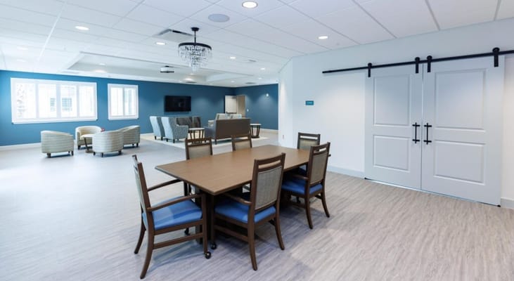 Bright and spacious common area with a dining table