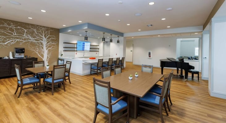 Interior view of a common area with tables and chairs