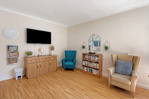 Common living area with seating and bookshelves