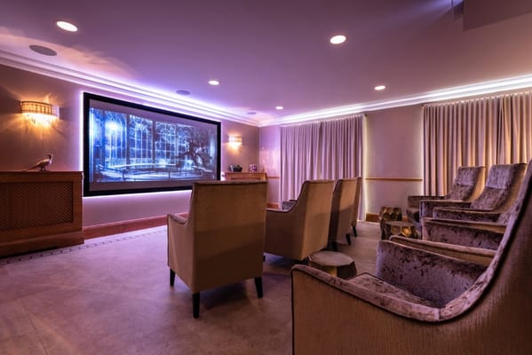 Interior of a cozy movie room with seating