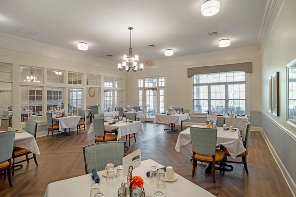 Dining room with tables set for residents