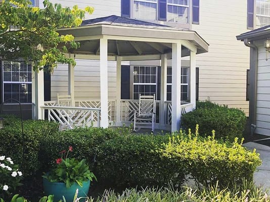 Outdoor gazebo surrounded by greenery