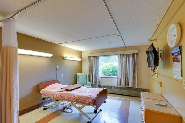 Private resident room with bed and window