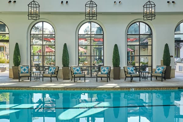 Indoor pool area with seating and decor