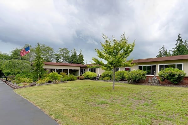 Exterior view of the facility with landscaped gardens