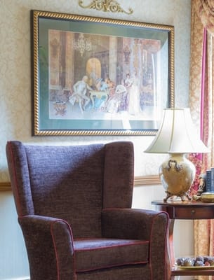 Cozy interior space with a chair and artwork