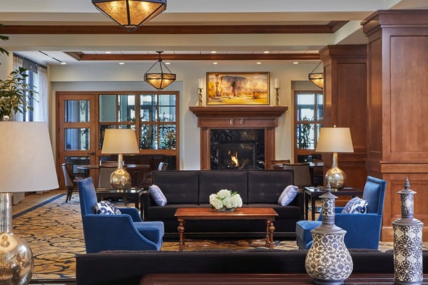 Interior common area with seating and a fireplace