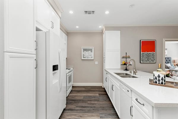Modern kitchen interior with white cabinets and counter