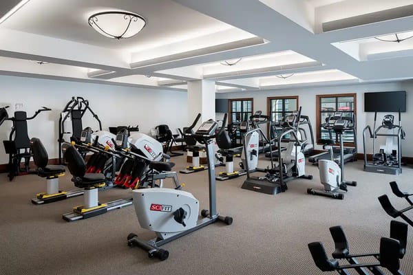 A well-equipped fitness center at the assisted living facility