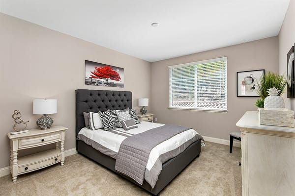 Stylishly furnished resident bedroom with natural light