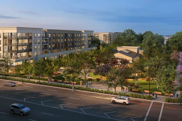 Aerial view of a senior living facility with gardens and buildings